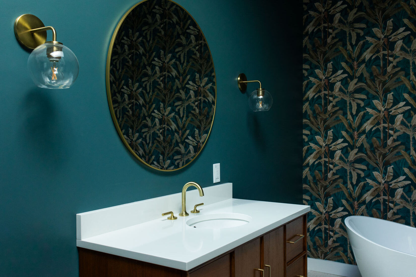 Modern Concord MA, bathroom remodel with a rich wooden vanity, new countertop, and freestanding bathtub