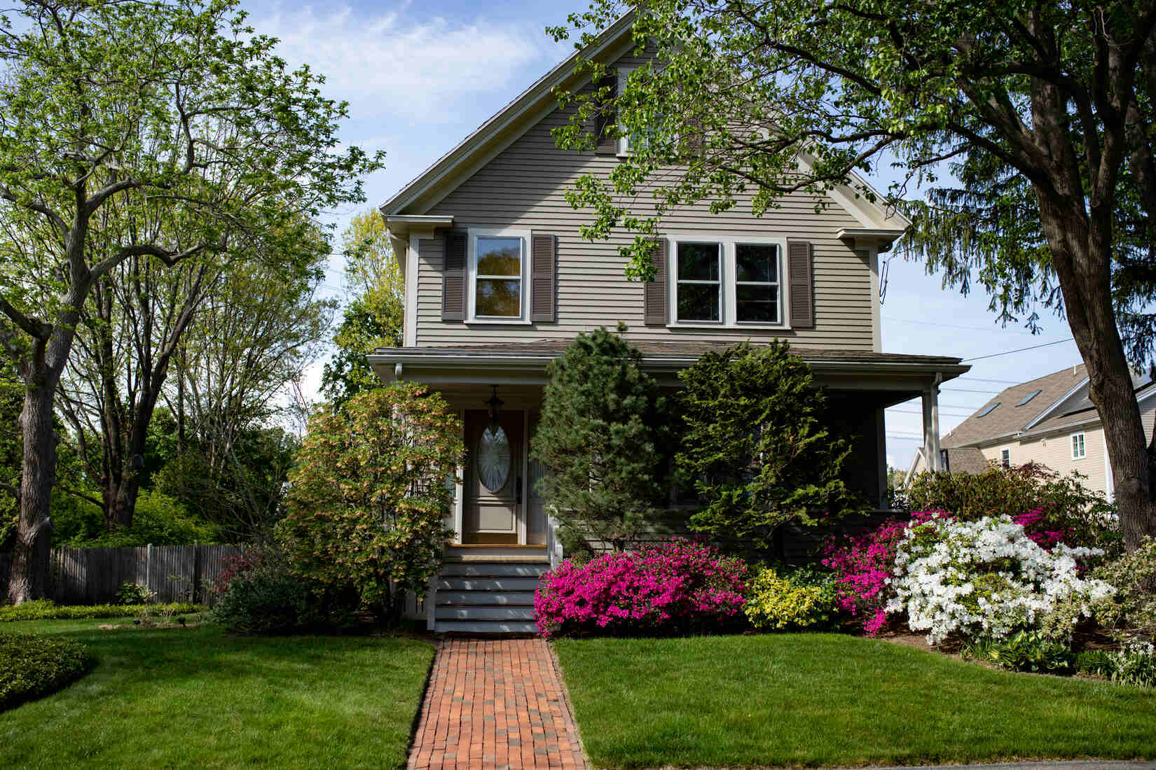 Beautifully painted home with lush landscaping in Needham, MA, completed by Tom Curren Companies