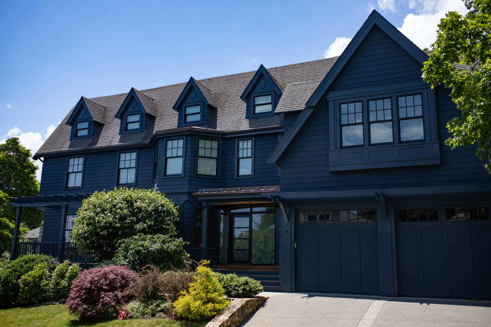 Elegant blue-painted home in Arlington, MA, expertly painted by Tom Curren Companies