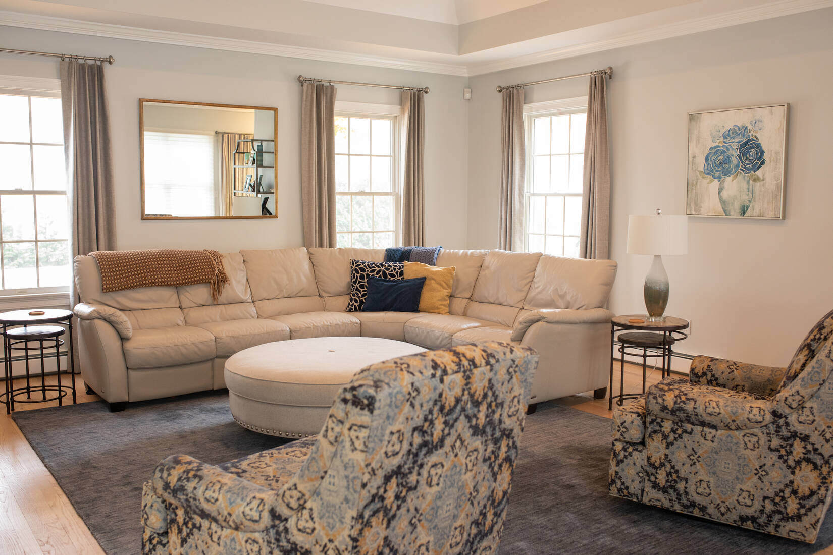 Lexington, MA living room transformation with fresh paint, elegant furnishings, and cozy seating by Tom Curren
