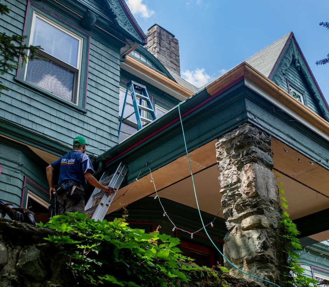 Tom Curren Company contractor installing wood gutters on a historic home in West Metro Boston, Winchester, MA