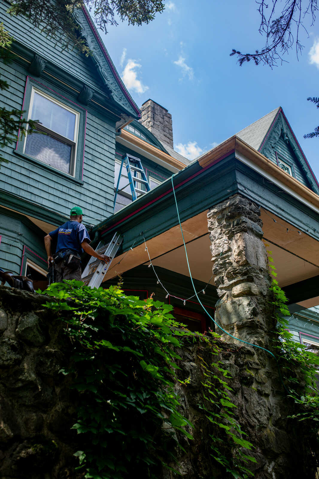 Tom Curren Companies contractor installing wood gutters on a historic home in Metrowest Boston, Winchester, MA