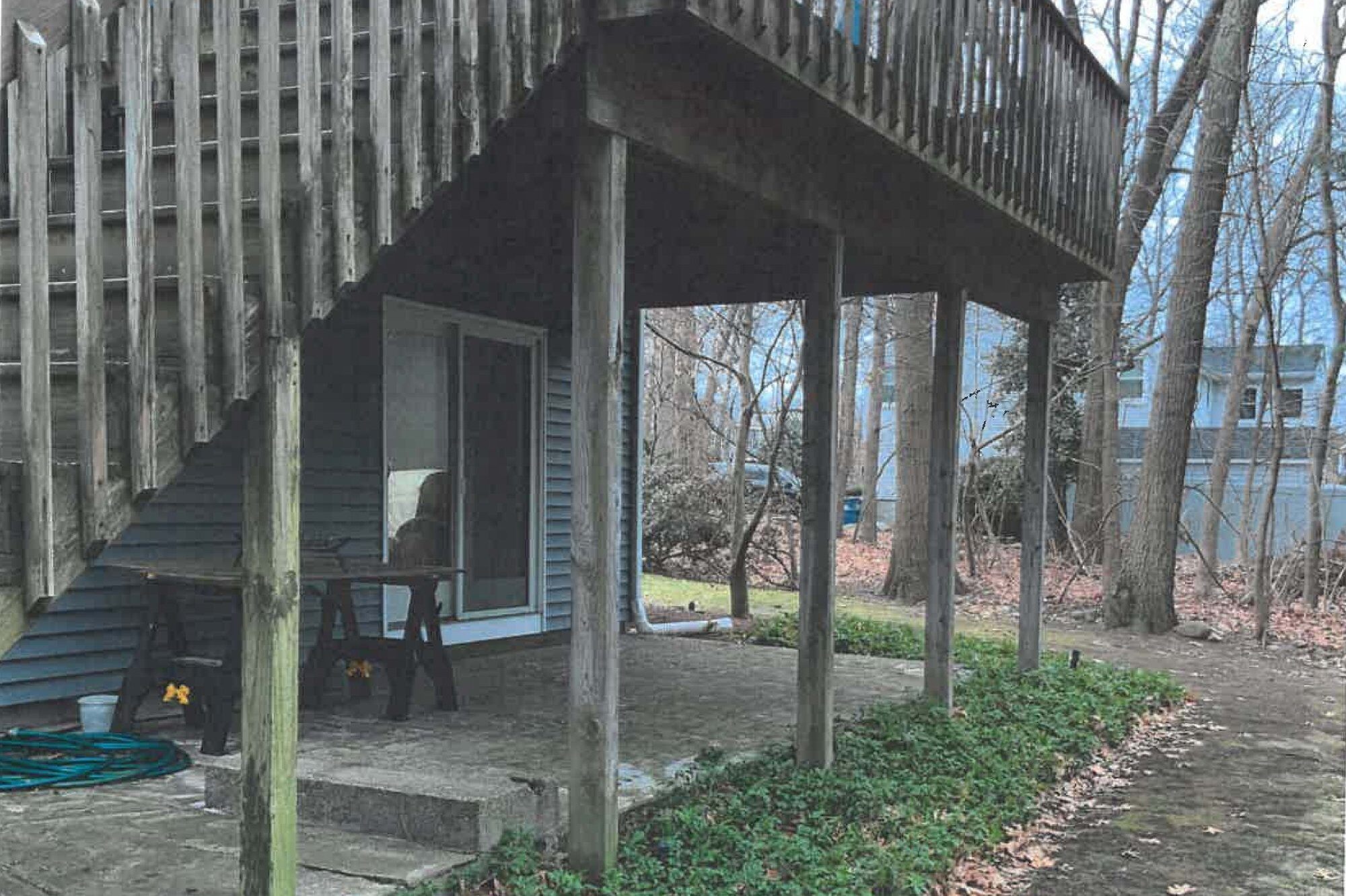 Before wood Deck Over Concrete space in Burlington MA