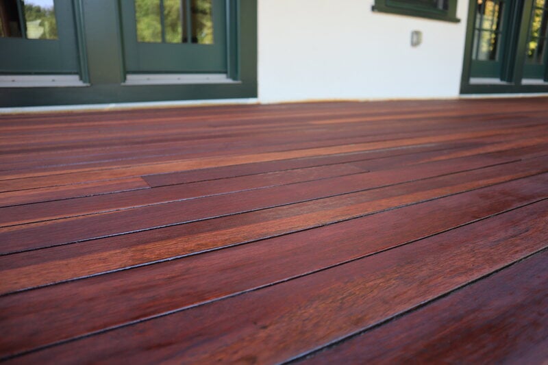 Close-up image of a dark wood stained deck.