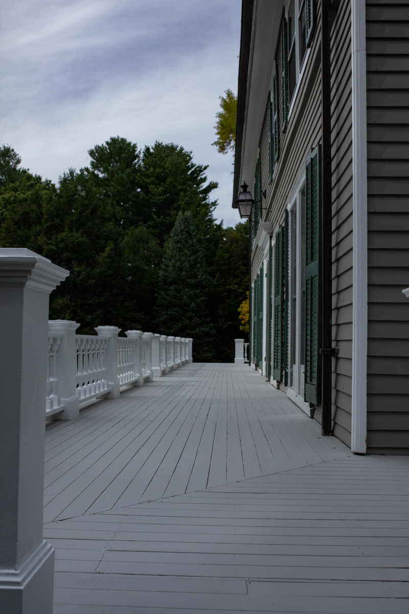 Light gray painted deck with white railing
