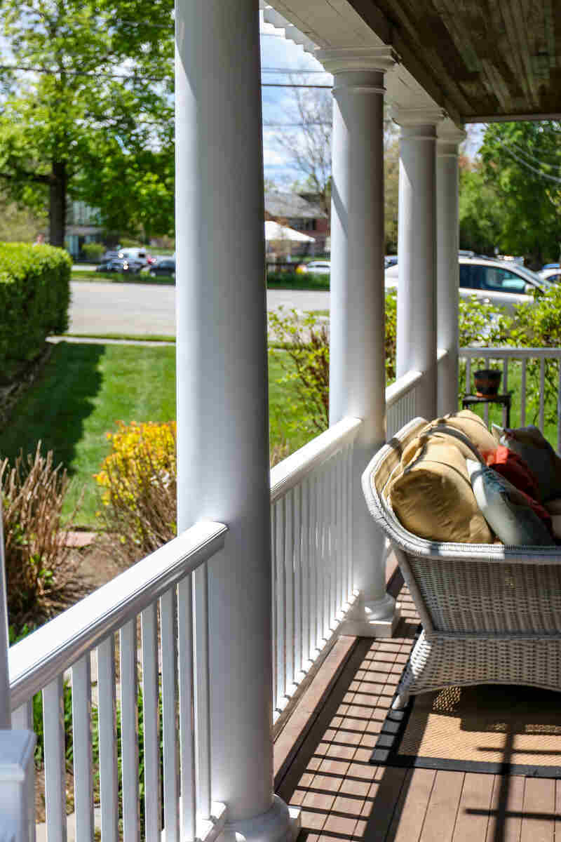 Deck with white railing and columns
