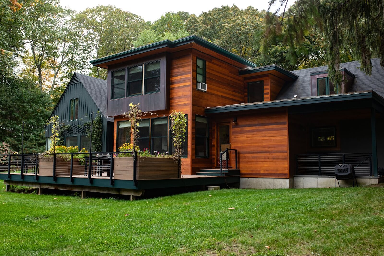 Modern home exterior with stained clapboard siding in Lincoln, Massachusetts.