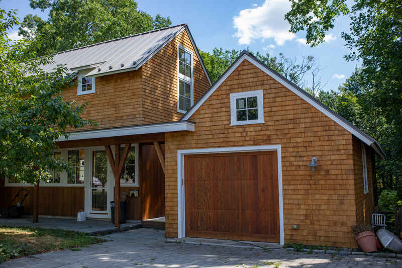 Exterior view of home with stained wood siding.
