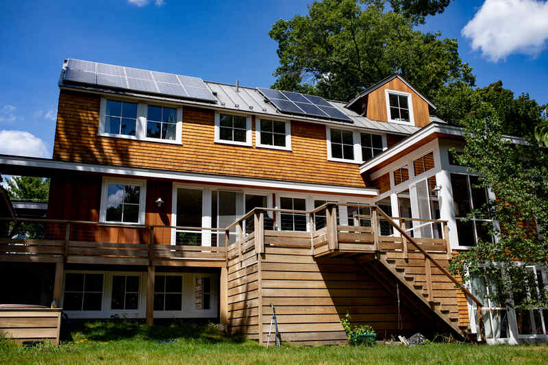 Exterior of home with stained wood siding.