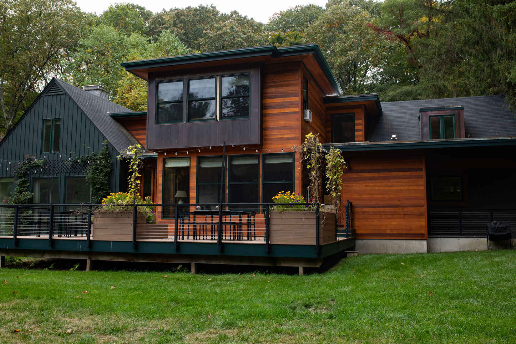 Custom exterior staining on a modern wood home in Lincoln, MA, completed by Tom Curren