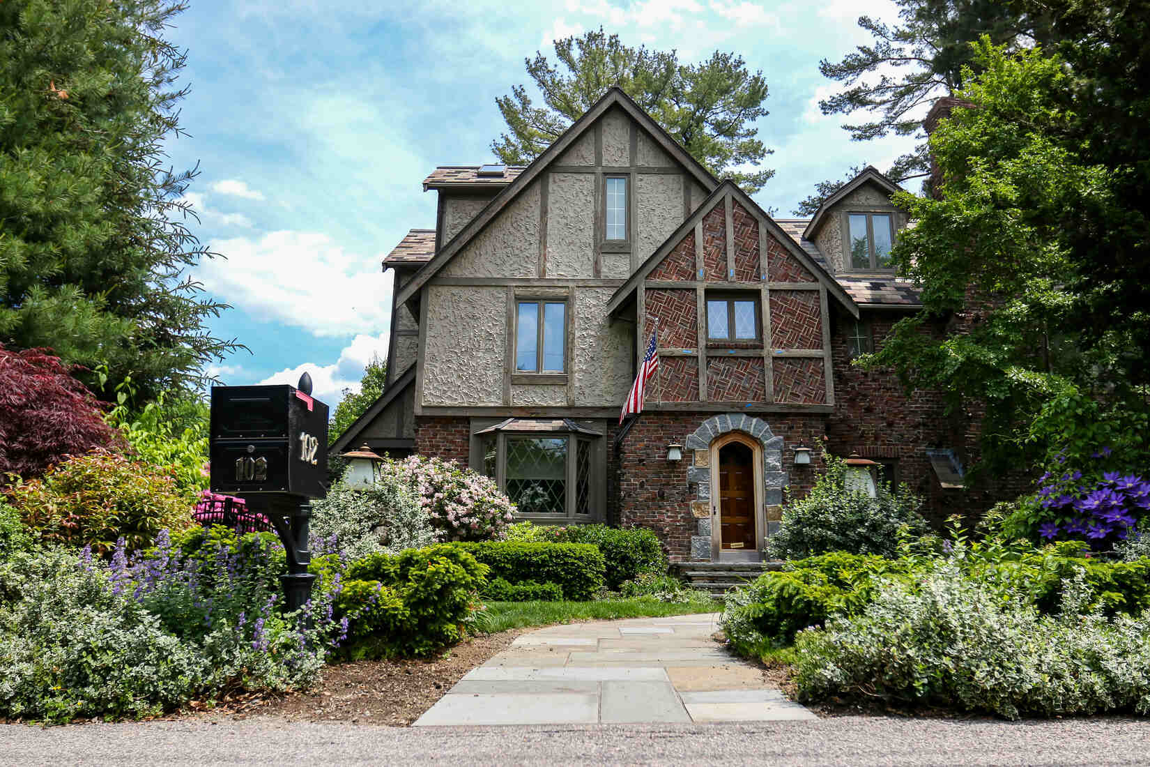 Gorgeous Tudor-style home in Newton, MA, featuring expert exterior painting by Tom Curren Companies
