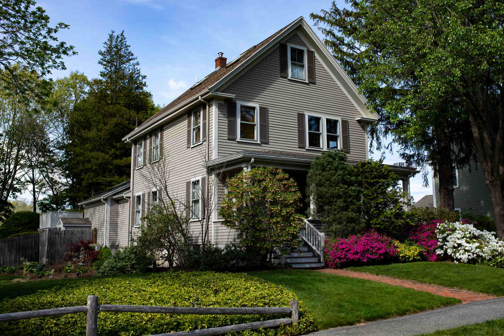 Traditional home in Needham, MA, featuring expert exterior painting by Tom Curren Companies