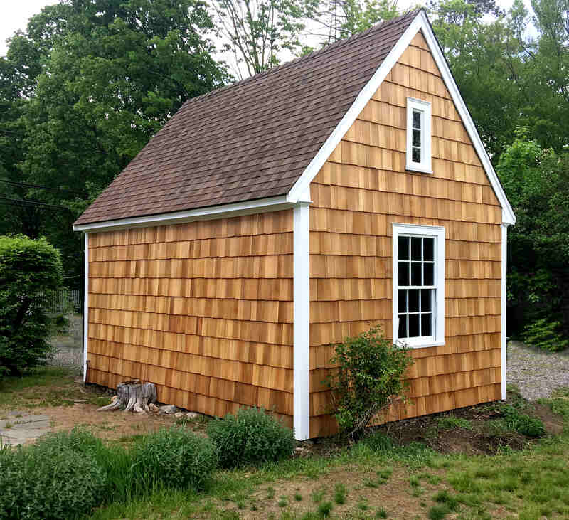 Backyard shed with wood siding
